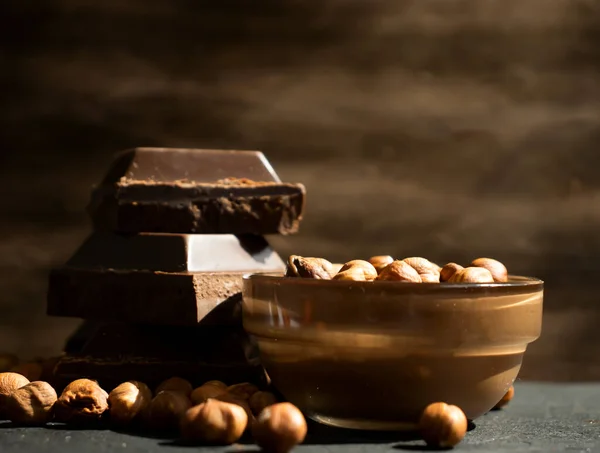 Chocolate paste, nuts on a dark background