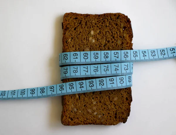 Bread Piece Measuring Tape Light Background — Stock Photo, Image