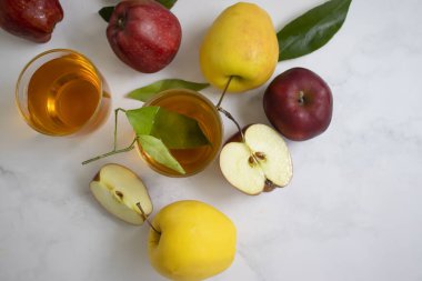 Fresh apple juice on a light background