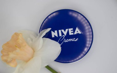 May 1, 2022 Ukraine city Kyiv jar of Nivea cream, narcissus flower