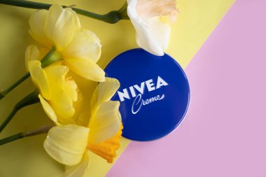 May 1, 2022 Ukraine city Kyiv jar of Nivea cream, narcissus flower