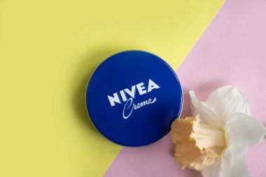 May 1, 2022 Ukraine city Kyiv jar of Nivea cream, narcissus flower