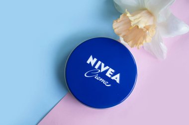 May 1, 2022 Ukraine city Kyiv jar of Nivea cream, narcissus flower