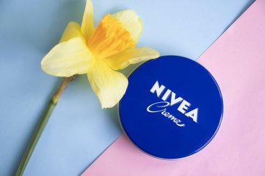 May 1, 2022 Ukraine city Kyiv jar of Nivea cream, narcissus flower