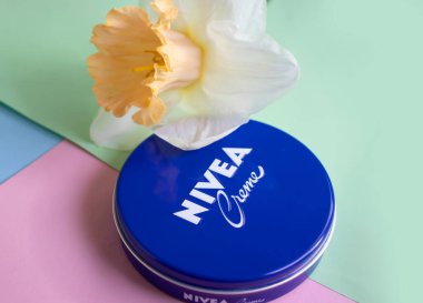 May 1, 2022 Ukraine city Kyiv jar of Nivea cream, narcissus flower