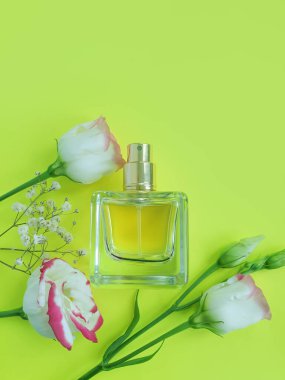 Perfume bottle, flower background