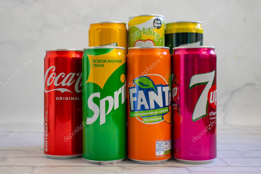 April 22, 2022 Ukraine city of Kyiv iron cans of Coca Cola, Sprite, Fanta, 7 up on a light backgroud