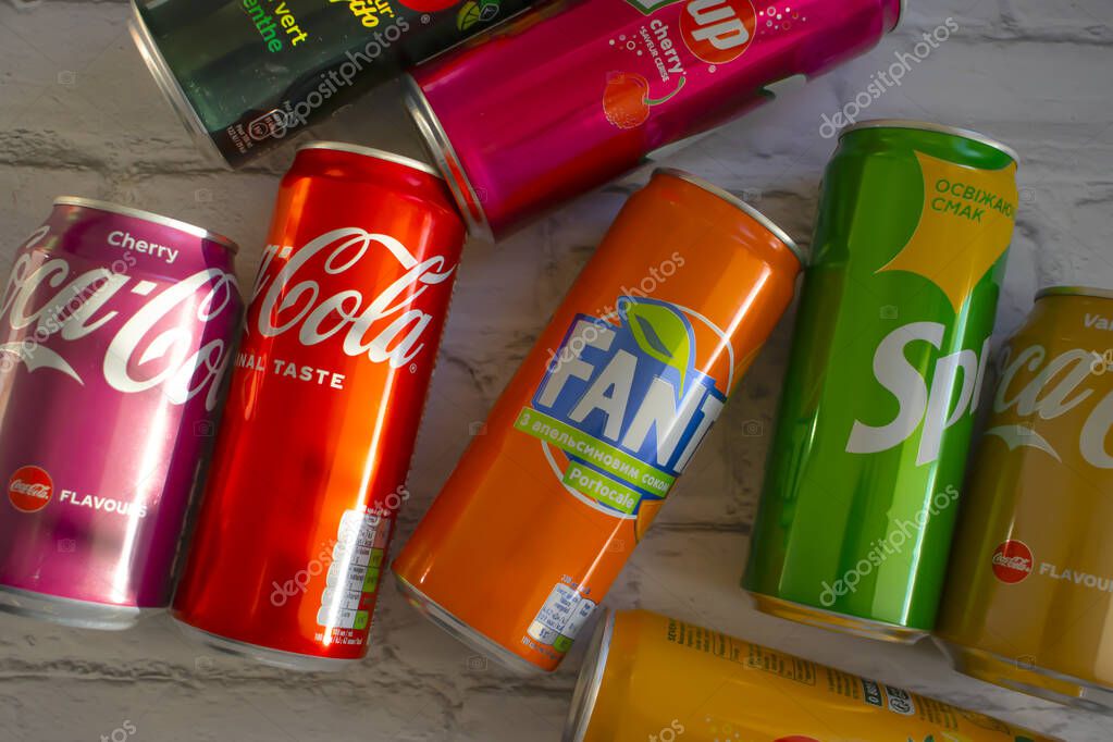 April 22, 2022 Ukraine city of Kyiv iron cans of Coca Cola, Sprite, Fanta, 7 up on a light backgroud