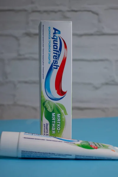 stock image April 20, 2023 Ukraine city Kyiv Aquafresh toothpaste on a colored background