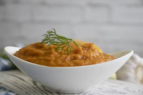 Squash caviar in a plate on an old background