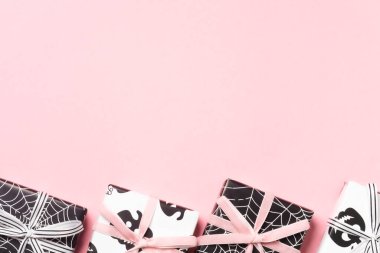 Halloween gift box with cat print and pink ribbon.