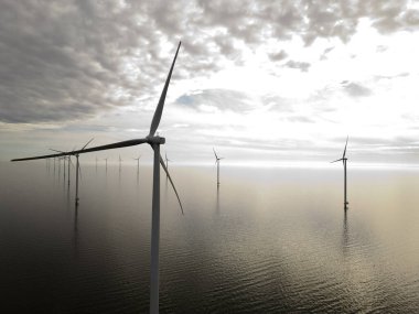 Windturbines in an offshore windpark, Ijsselmeer, Breezanddijk, The Netherlands clipart