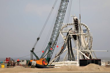 Connecting a seacable from an offshore windpark to an onshore power hub in Wijk aan Zee, the Netherlands clipart