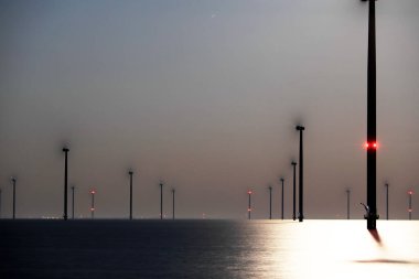 An offshore windpark at night, Breezanddijk, The Netherlands clipart