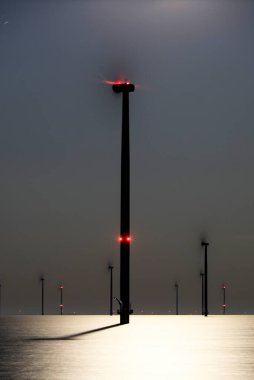 An offshore windpark at night, Breezanddijk, The Netherlands clipart