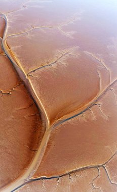 Aerial view of the tidal mudflats and channels of the Eemsdelta, Groningen, The Netherlands clipart