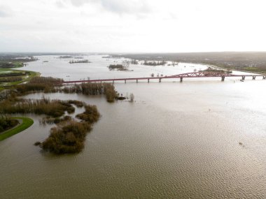 Aerial view of the elevated water levels in the Ijssel river near the village of Zwolle, The Netherlands clipart