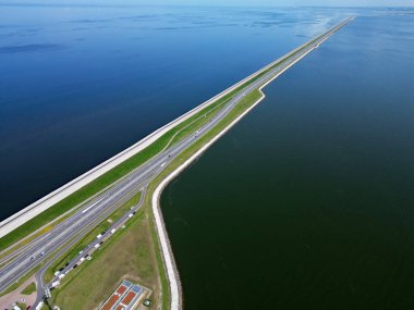 The Afsluitdijk, a famous dyke in the North of Holland, seperating the Ijssel lake from the Wadden Sea, The Netherlands clipart