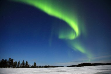 Aurora Borealis seen at lake Inari, Northern Finland clipart