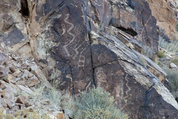 Petroglyphs written by the Hopi Indians at Parowan Gap, Utah. Symbols include clan signs and directional references. It is believed that the Fremont indians wrote most of the petroglyphs.