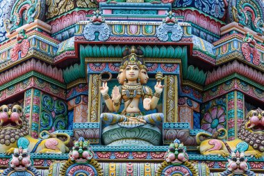 Colored decorations and statues on the exterior of the Hindu Temple Sri Maha Mariamman Temple (