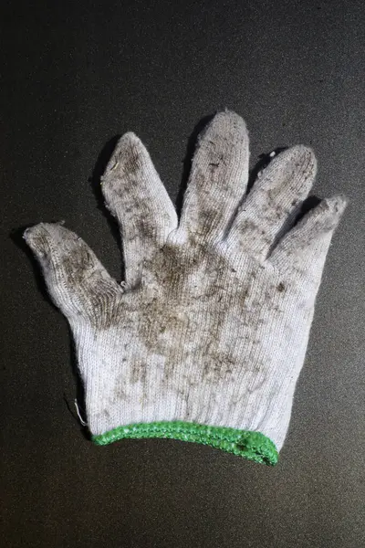 Dirty knitted glove on white background, One piece of contaminated knitted, For industry, garden