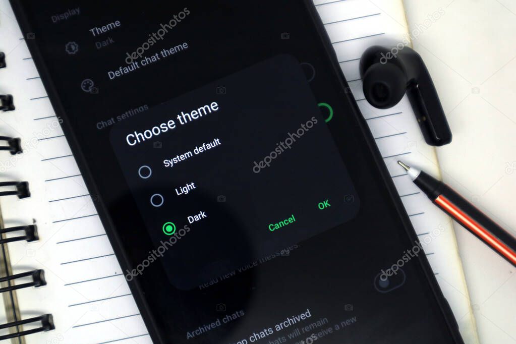 Madiun, Indonesia - September 20, 2025: The dark or light theme option on the WhatsApp application is displayed on Android smartphones.