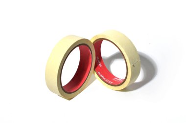 Two beige masking tape rolls with red inner cores placed together on a white background, ideal for design, office, or craft illustrations.