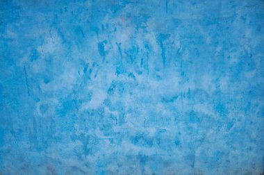 Vibrant Blue Textured Wall Background with Subtle Color Variations and Gradients.