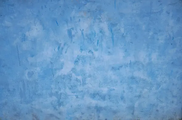 Vibrant Blue Textured Wall Background with Subtle Color Variations and Gradients.