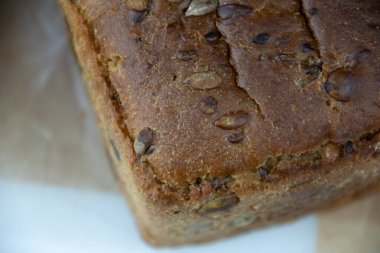 bakery products, bun with poppy seeds in a paper bag