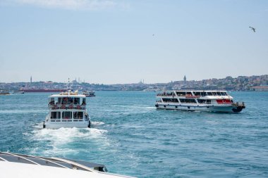 Istanbul, Turkey - 26 August 2025: Istanbul Bosphorus Strait with boats, ferries, bridges and city skyline. Panoramic view of strait connecting two continents. European and Asian sides of city