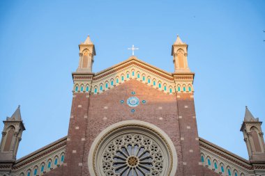 Historic Church of St. Anthony of Padua facade with ornate details against clear blue sky. Sant'Antonio di Padova Catholic church exterior in Taksim, Istanbul, Turkey