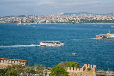 Istanbul, Turkey - 26 August 2025: Istanbul Bosphorus Strait with boats, ferries, bridges and city skyline. Panoramic view of strait connecting two continents. European and Asian sides of city