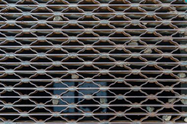A ventilation grate that also serves as a sewer grate on the streets of Manhattan.
