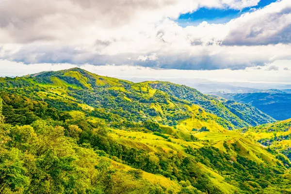 stock image Verdant slopes of Monteverde under a dynamic sky, showcasing the rich biodiversity and layered mountain vistas of Puntarenas Province, Costa Rica. High quality photo