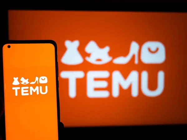 A smartphone displaying the Temu app logo in front of a larger, illuminated background showing the Temu logo.
