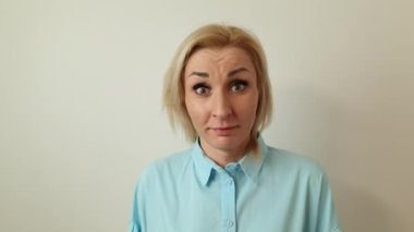 Closeup of attractive young amazed blond lady. Surprise, amazement, shock concept
