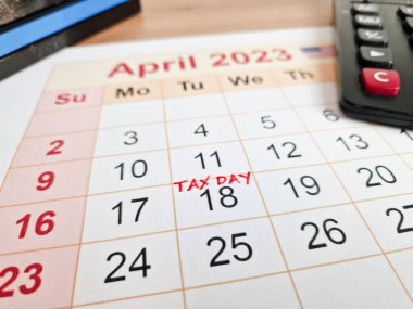 Tax payment day marked on a calendar - April 18, 2023, financial concept