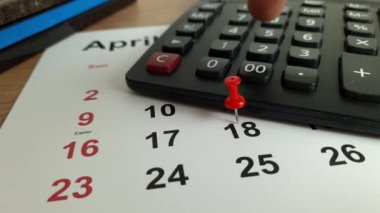 Tax payment day marked on a calendar - April 18, 2023, financial concept