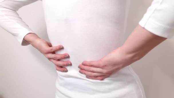 Adult Woman Touching Her Lower Back While Standing Suffering Unbearable — Video