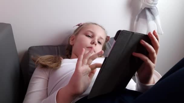 Serious Little Caucasian Child Girl Use Tablet Computer Play Online — 图库视频影像