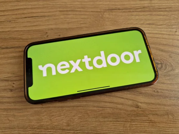 stock image Konskie, Poland - May 20, 2023: Nextdoor social networking service logo displayed on mobile phone screen