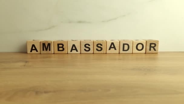 Palabra Embajador Bloques Madera Escritorio — Vídeos de Stock
