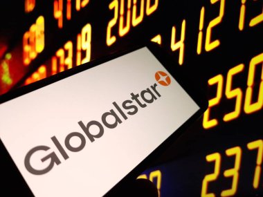 Konskie, Poland - May 15, 2024: Globalstar company logo displayed on mobile phone clipart