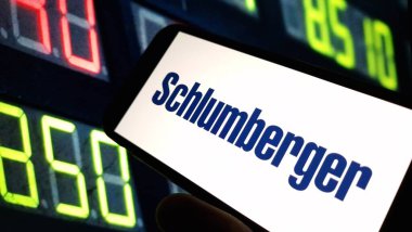 Konskie, Poland - November 18, 2024: Schlumberger company logo displayed on mobile phone clipart