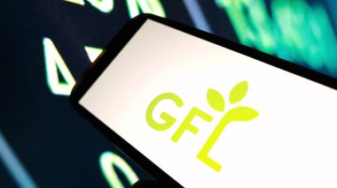 Konskie, Poland - December 03, 2024: GFL Environmental company logo displayed on mobile phone clipart