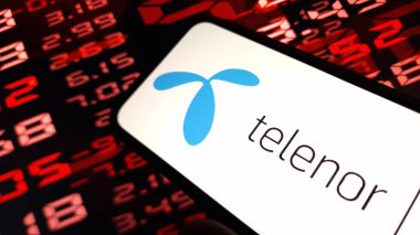 Konskie, Poland - December 08, 2024: Telenor company logo displayed on mobile phone clipart