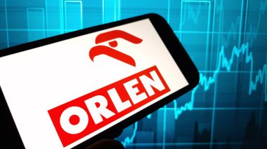 Konskie, Poland - December 08, 2024: PKN Orlen company logo displayed on mobile phone clipart