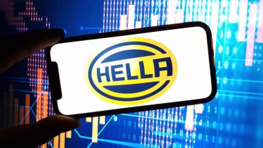 Konskie, Poland - December 15, 2024: Hella company logo displayed on mobile phone clipart